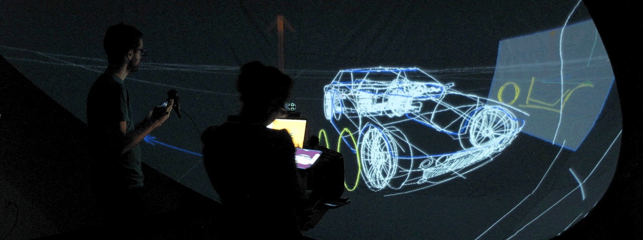 Deux designers esquissent une voiture dans l'environnement virtuel Hyve-3D au moyen de leurs tablettes tactiles.