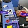 Photo d'une découpeuse laser avec 3 boutons (précédent, menu et suivant) et l'instruction