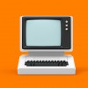 Un ordinateur ancien sur fond orange